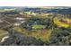 Aerial view of property with a house, large grassy areas, trees, and distant pastures at 2610 Stephens Rd, Groveland, FL 34736