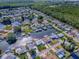 Sprawling waterfront community showcasing a network of canals, well-maintained homes, and lush green vegetation at 26608 E Cove Dr, Tavares, FL 32778