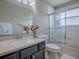 Bathroom featuring a modern vanity and a shower/tub combination at 26608 E Cove Dr, Tavares, FL 32778