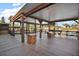 Spacious wooden deck with covered area, lake view, perfect for outdoor entertaining and relaxing at 26608 E Cove Dr, Tavares, FL 32778