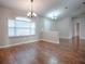 Dining area with hard wood floors and chandeliers at 26608 E Cove Dr, Tavares, FL 32778