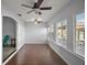 Bright dining area featuring natural light, window, and wood floors at 26608 E Cove Dr, Tavares, FL 32778