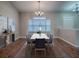 Dining room features hardwood floors and a modern chandelier at 26608 E Cove Dr, Tavares, FL 32778