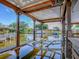 Waterfront dock with a covered structure and boat lift with canal views at 26608 E Cove Dr, Tavares, FL 32778
