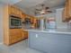 Bright kitchen with stainless steel appliances and quartz countertop at 26608 E Cove Dr, Tavares, FL 32778