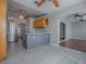 Kitchen with an island, hardwood floors, wooden cabinets and stainless steel appliances at 26608 E Cove Dr, Tavares, FL 32778