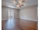 Open-concept living room featuring laminate flooring and great natural light at 26608 E Cove Dr, Tavares, FL 32778