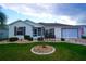 Home with a manicured lawn, enhanced by decorative rock and shrubbery landscaping in the front yard at 2682 Edwards Ln, The Villages, FL 32162