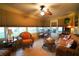 Inviting sunroom with tile flooring, comfortable seating and a dining table at 2682 Edwards Ln, The Villages, FL 32162