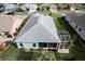 Aerial view of the home featuring a new roof and screened-in patio at 27004 Nature View St, Leesburg, FL 34748