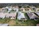 This aerial view shows the home's backyard with its screened-in patio at 27004 Nature View St, Leesburg, FL 34748