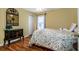 Cozy bedroom with bright walls, wood floors, and natural light at 27004 Nature View St, Leesburg, FL 34748