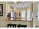 Kitchen with granite counters, stainless steel appliances and breakfast bar at 27004 Nature View St, Leesburg, FL 34748