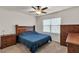 Comfortable bedroom featuring a ceiling fan and a large window that provides natural light at 28026 Cypress Springs Loop, Okahumpka, FL 34762