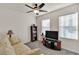 Cozy living room featuring neutral walls, carpeted floors, and a ceiling fan at 28026 Cypress Springs Loop, Okahumpka, FL 34762