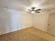 Bedroom features neutral walls, ceiling fan with light, and tile floors at 301 Clark St, Maitland, FL 32751