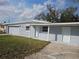 View of a one story house with a well-maintained lawn, garage, and front entrance at 301 Clark St, Maitland, FL 32751