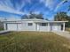 Charming single-story home with a well-maintained lawn and a freshly painted gray exterior at 301 Clark St, Maitland, FL 32751