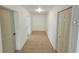 Hallway features neutral walls, tile floors, two doorways, and a closet at 301 Clark St, Maitland, FL 32751