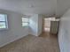 Living room features neutral walls, tile floors, two windows and a door at 301 Clark St, Maitland, FL 32751