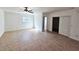 A spacious main bedroom featuring tile floors, a window for natural light, and closet at 301 Clark St, Maitland, FL 32751