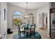 Charming breakfast nook featuring a round table, modern lighting, and large windows at 3261 Wise Way, The Villages, FL 32163