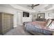 Main bedroom with a ceiling fan, ample closet space, and neutral color palette at 3261 Wise Way, The Villages, FL 32163