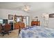 Bedroom featuring wood furnishings, ensuite bath, and serene ambiance for relaxation and comfort at 3323 Manatee Rd, Tavares, FL 32778