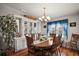 Elegant dining room with hardwood floors and a chandelier at 3323 Manatee Rd, Tavares, FL 32778