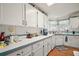 Bright kitchen with ample counter space and white cabinets at 3323 Manatee Rd, Tavares, FL 32778