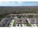 Aerial view of a residential neighborhood with mature trees and landscaping at 339 Winter Nellis Cir, Winter Garden, FL 34787