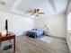 Bedroom features a tray ceiling, ceiling fan, and wood-style flooring at 339 Winter Nellis Cir, Winter Garden, FL 34787