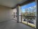 Covered balcony with black metal railing overlooking the parking lot at 3605 Conroy Rd # 535, Orlando, FL 32839