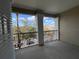 Covered balcony with black metal railing overlooking the parking lot at 3605 Conroy Rd # 535, Orlando, FL 32839