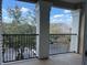 Covered balcony with black metal railing overlooking the parking lot at 3605 Conroy Rd # 535, Orlando, FL 32839