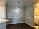 Dining area featuring a pendant light, neutral paint, and easy access to the laundry room at 3605 Conroy Rd # 535, Orlando, FL 32839