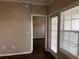 Inviting entryway with wood flooring and a door with windows allowing natural light in at 3605 Conroy Rd # 535, Orlando, FL 32839