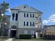 Attractive building exterior with private balcony and manicured landscaping under clear blue skies at 3605 Conroy Rd # 535, Orlando, FL 32839