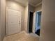 Welcoming hallway featuring tile flooring and a door leading to the bathroom at 3605 Conroy Rd # 535, Orlando, FL 32839