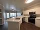 A bright and airy kitchen boasts stainless steel appliances and opens to a living area at 3605 Conroy Rd # 535, Orlando, FL 32839