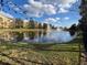 Scenic view of a pond with fountains and buildings in the background at 3605 Conroy Rd # 535, Orlando, FL 32839