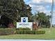 Community sign for Mosaic at Millenia is surrounded by lush landscaping at 3605 Conroy Rd # 535, Orlando, FL 32839