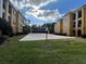 Community sand volleyball court surrounded by lush green grass at 3605 Conroy Rd # 535, Orlando, FL 32839