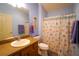 Bathroom with vanity, seashell shower curtain and blue walls at 3780 Viscaya Ct, The Villages, FL 32163