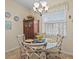 Charming breakfast nook with glass table and decorative plates at 3808 Serena Ln, Clermont, FL 34711