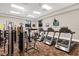 Well-equipped gym featuring treadmills and weight-training machines for a complete workout at 3808 Serena Ln, Clermont, FL 34711