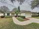 Charming single-story home with inviting entrance and lush landscaping at 3847 Eversholt St, Clermont, FL 34711