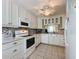 Bright and airy kitchen with white cabinets, modern appliances, and neutral countertops at 3847 Eversholt St, Clermont, FL 34711