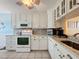 A kitchen with all-white cabinetry and countertops at 3847 Eversholt St, Clermont, FL 34711