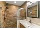 Modern bathroom featuring a wood-look tile shower, a single sink vanity, and updated fixtures at 40707 E Ninth Ave, Umatilla, FL 32784